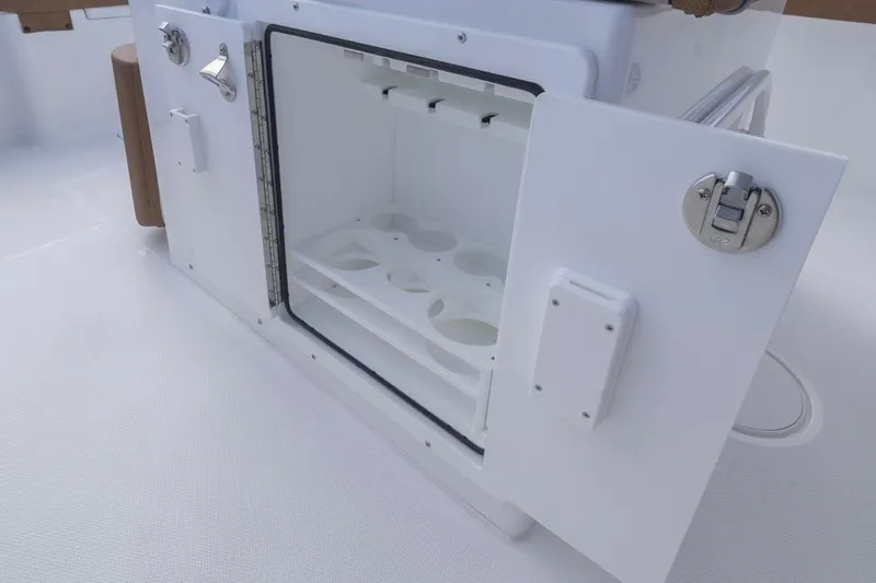  Yacht Photos Pics Open storage compartment on 2026 Sea Hunt Ultra 275 SE boat, featuring cup holders.