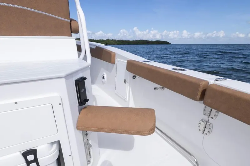  Yacht Photos Pics 2026 Sea Hunt Ultra 275 SE boat interior with brown seating, ocean view.