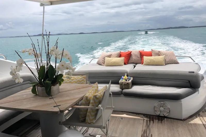  Yacht Photos Pics Luxurious Sunseeker Predator 82 yacht deck with elegant seating and ocean view, 2006 model.