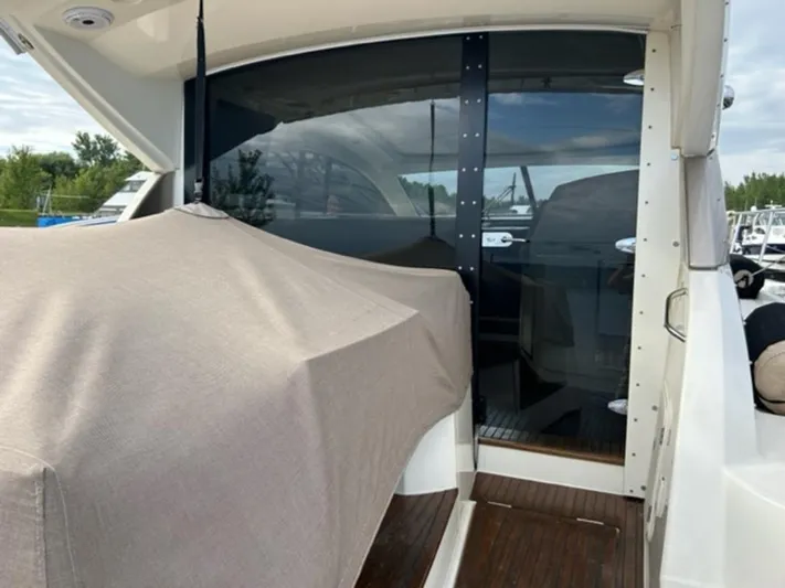  Yacht Photos Pics Prestige 440 S yacht, 2012 model, covered deck area with glass doors.