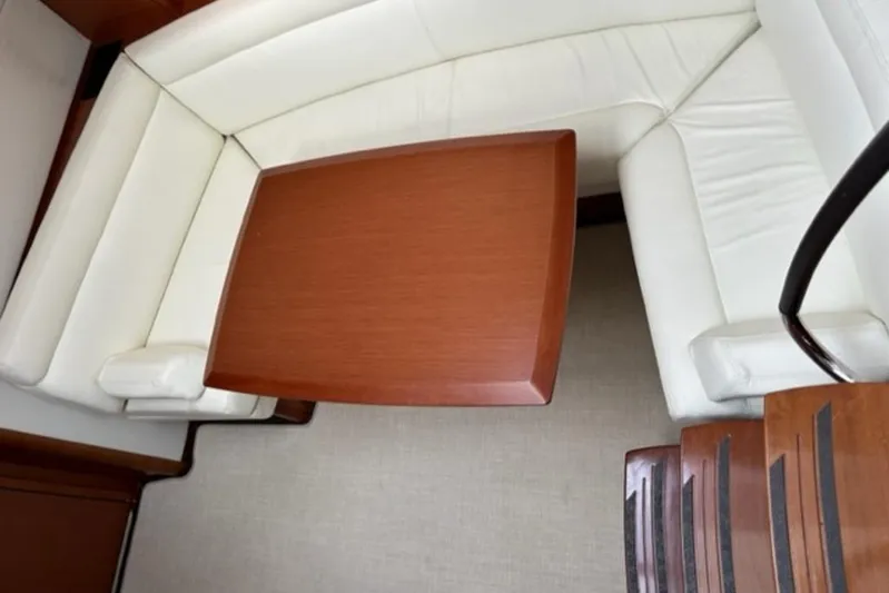  Yacht Photos Pics Luxurious white leather seating with wooden table on 2012 Prestige 440 S yacht.