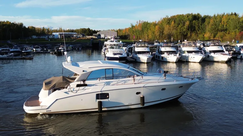 Yacht Photos Pics Luxury 2012 Prestige 440 S yacht docked in a scenic marina setting.