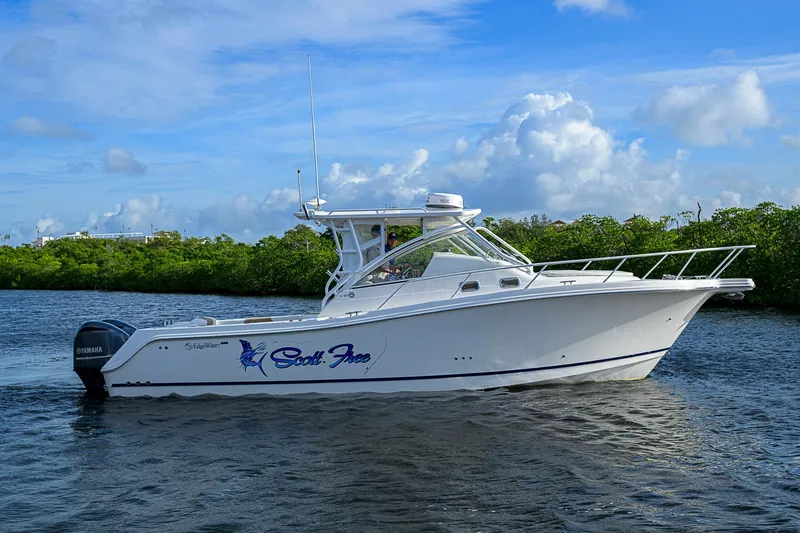  Yacht Photos Pics 2016 Edgewater 335 Express boat on water, clear sky background.