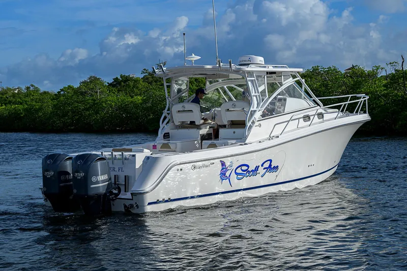  Yacht Photos Pics 2016 Edgewater 335 Express boat cruising on a scenic waterway.