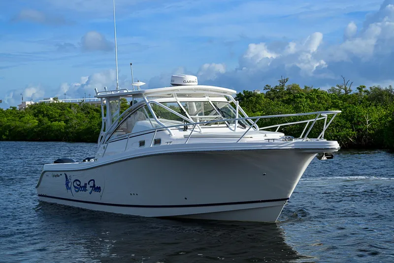  Yacht Photos Pics 2016 Edgewater 335 Express boat cruising on a scenic waterway.