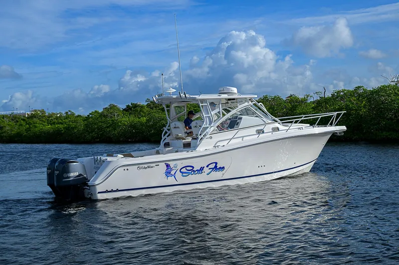  Yacht Photos Pics 2016 Edgewater 335 Express boat cruising on a scenic waterway.