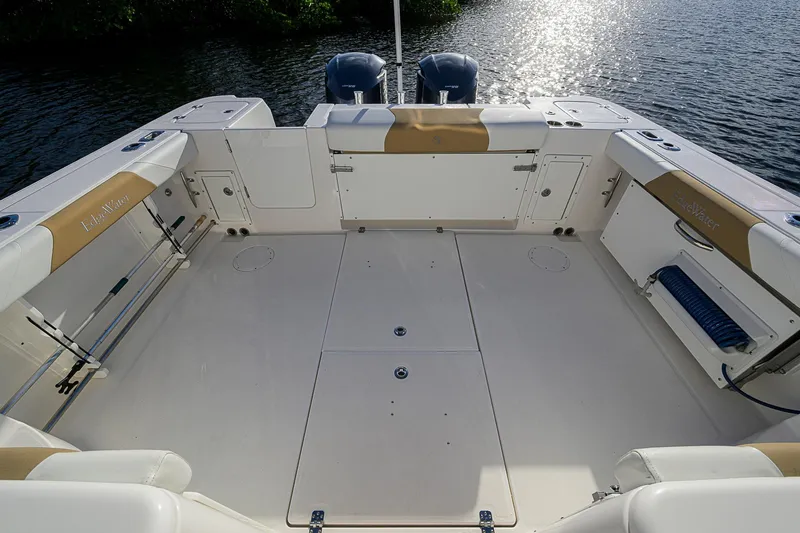  Yacht Photos Pics 2016 Edgewater 335 Express boat deck with seating and storage, overlooking water.