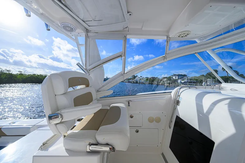  Yacht Photos Pics 2016 Edgewater 335 Express boat interior with luxurious seating and scenic water view.