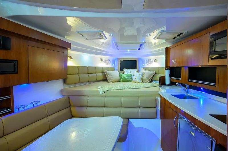  Yacht Photos Pics Luxurious interior of 2016 Edgewater 335 Express boat with modern amenities and cozy seating.