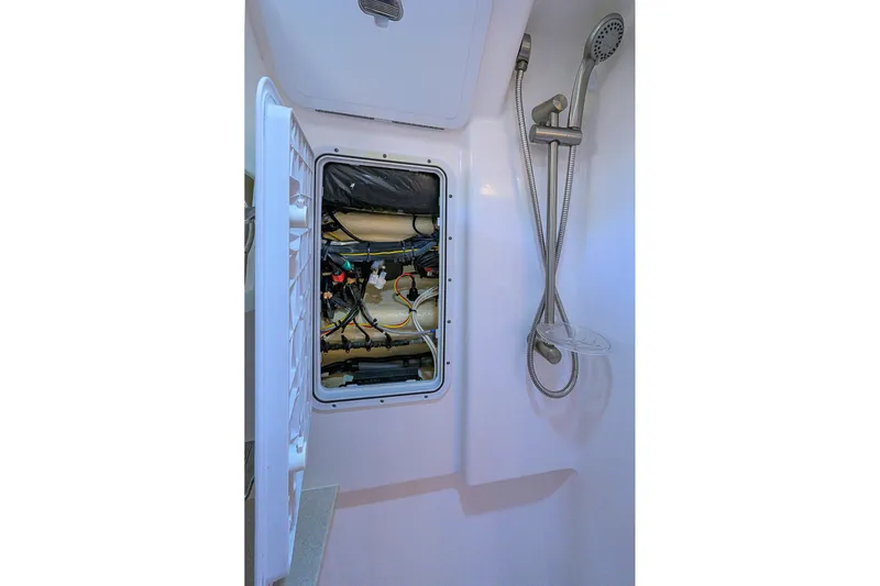  Yacht Photos Pics Shower area with open access panel on 2016 Edgewater 335 Express boat.