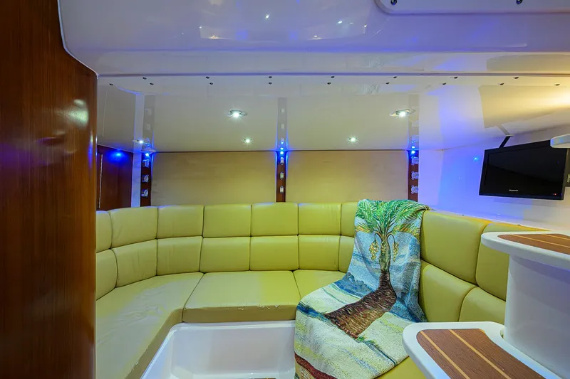  Yacht Photos Pics Luxurious interior of 2016 Edgewater 335 Express boat with cozy seating and modern amenities.