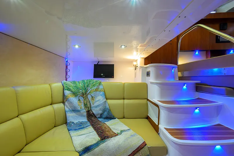  Yacht Photos Pics Luxurious interior of 2016 Edgewater 335 Express boat with cozy seating and ambient lighting.