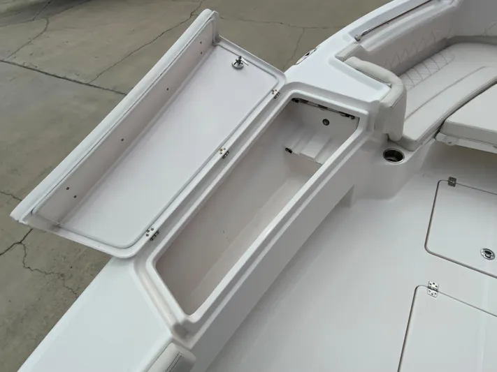  Yacht Photos Pics 2021 Blue Wave 2800 Makaira boat storage compartment and seating area.