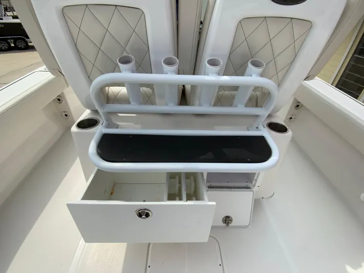  Yacht Photos Pics 2021 Blue Wave 2800 Makaira boat interior with rod holders and storage drawer.