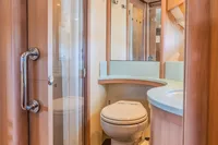 Luxurious bathroom interior of 2005 Astondoa 53 Open yacht with modern fixtures.