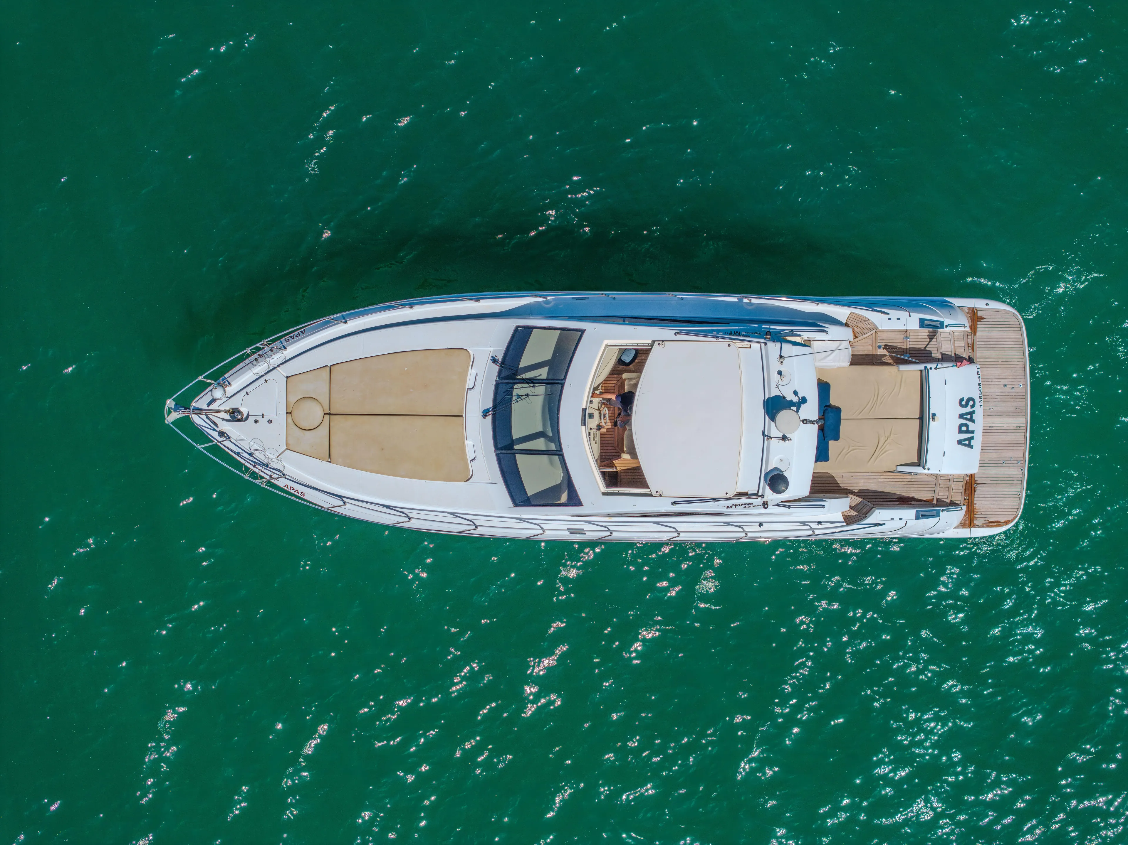 Aerial view of 2005 Astondoa 53 Open yacht on turquoise water.