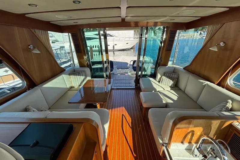 Salish Sky Yacht Photos Pics Luxurious interior of 2015 Sabre 54 Salon Express yacht with elegant seating and wood finishes.