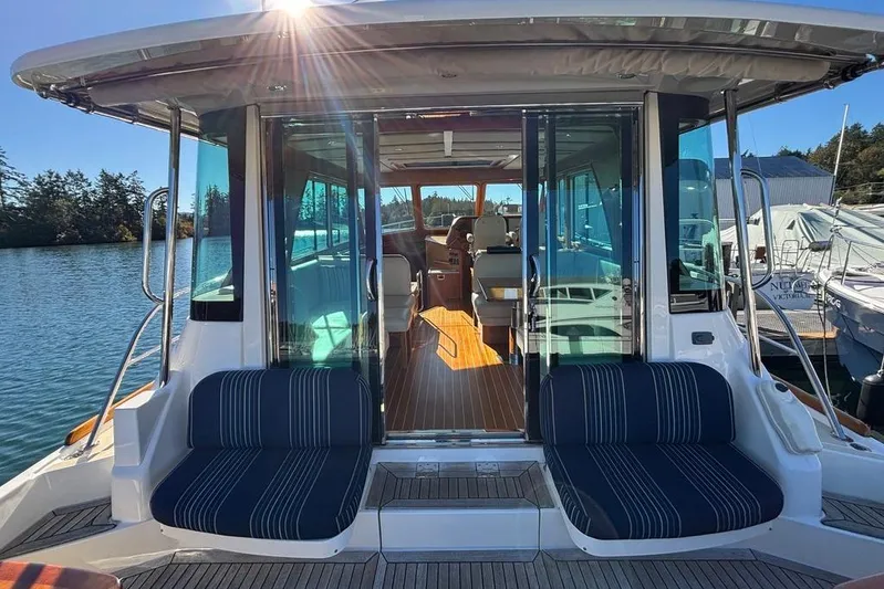 Salish Sky Yacht Photos Pics 2015 Sabre 54 Salon Express yacht with elegant seating and sunlit interior.