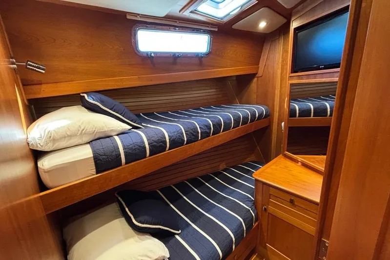 Salish Sky Yacht Photos Pics 2015 Sabre 54 Salon Express cabin with bunk beds and wooden interior.