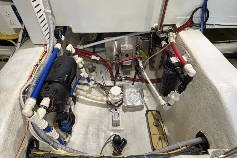 Salish Sky Yacht Photos Pics Engine room of 2015 Sabre 54 Salon Express with complex piping and wiring system.