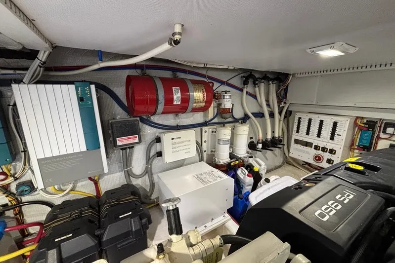 Salish Sky Yacht Photos Pics Engine room of 2015 Sabre 54 Salon Express with various mechanical components and wiring.