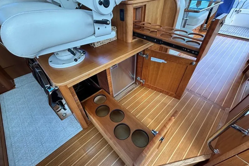 Salish Sky Yacht Photos Pics Interior of 2015 Sabre 54 Salon Express with wooden cabinetry and cup holders.