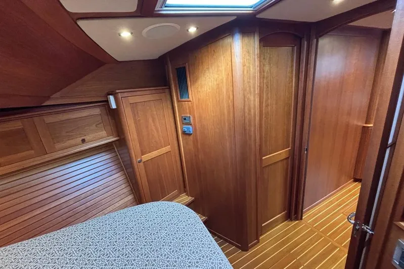 Salish Sky Yacht Photos Pics Interior of 2015 Sabre 54 Salon Express, featuring elegant wood paneling and cozy cabin design.