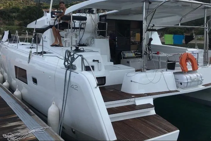 Mojito Yacht Photos Pics Luxury 2020 Lagoon 42 catamaran docked, featuring spacious deck and modern design.