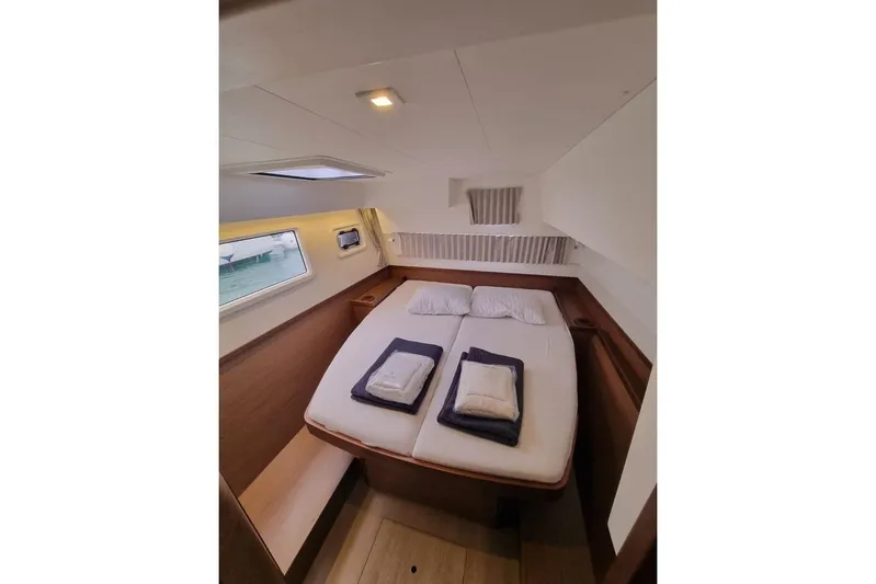Mojito Yacht Photos Pics Luxurious cabin interior of 2020 Lagoon 42 yacht with cozy double bed.
