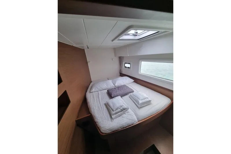 Mojito Yacht Photos Pics Cozy bedroom in 2020 Lagoon 42 yacht with skylight and window view.