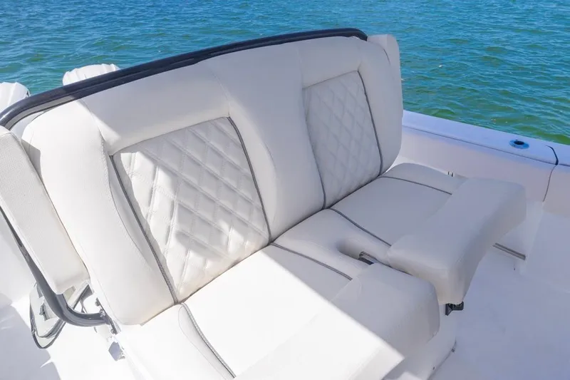  Yacht Photos Pics 2026 Sea Hunt Gamefish 27 Forward Seating with luxurious white upholstery on a sunny day.