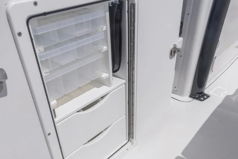  Yacht Photos Pics Storage compartment on 2026 Sea Hunt Gamefish 27 Forward Seating boat, featuring organized tackle boxes.