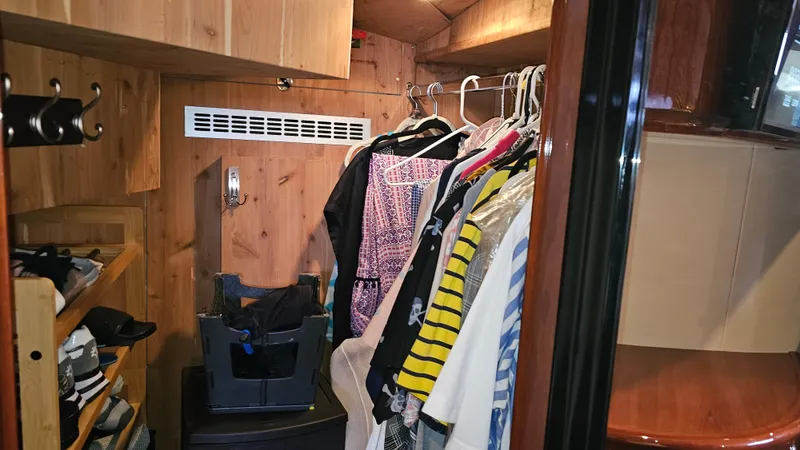 Dream Team Xiii Yacht Photos Pics Clothing storage area inside 2005 Neptunus 56 Flybridge yacht with wooden interior.