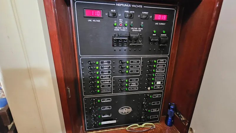 Dream Team Xiii Yacht Photos Pics Electrical panel of 2005 Neptunus 56 Flybridge yacht with control switches and indicators.