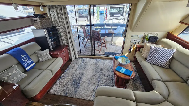 Dream Team Xiii Yacht Photos Pics Luxurious interior of 2005 Neptunus 56 Flybridge yacht with elegant seating and decor.