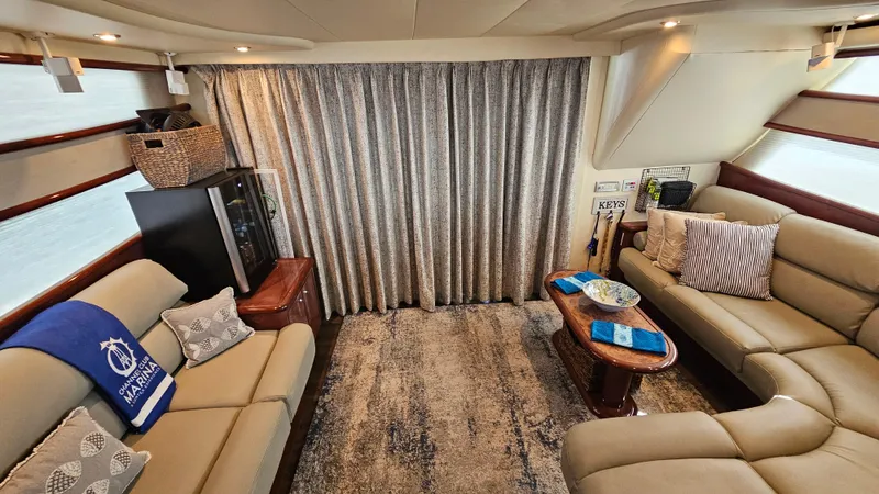 Dream Team Xiii Yacht Photos Pics Luxurious interior of 2005 Neptunus 56 Flybridge yacht with elegant seating and decor.