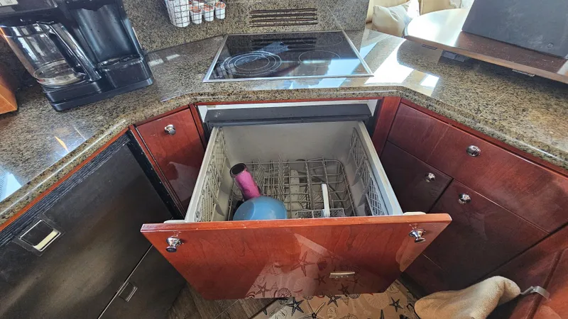 Dream Team Xiii Yacht Photos Pics Luxury Neptunus 56 Flybridge 2005 yacht kitchen with dishwasher and granite countertops.