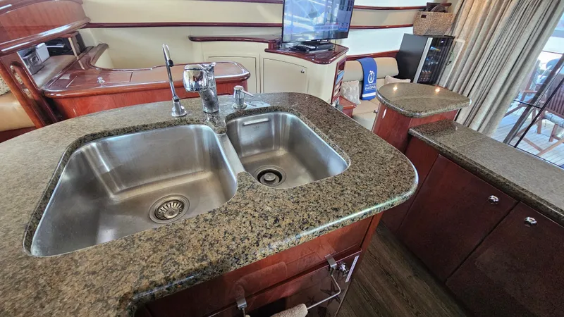 Dream Team Xiii Yacht Photos Pics Luxurious kitchen area in 2005 Neptunus 56 Flybridge yacht with granite countertops.