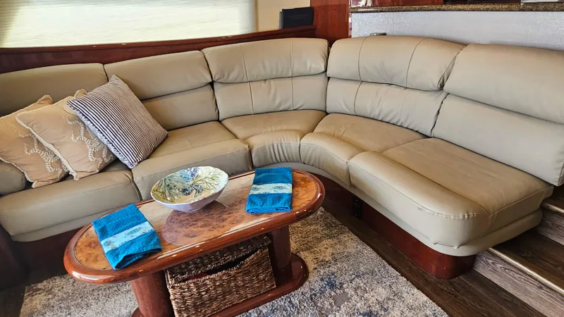 Dream Team Xiii Yacht Photos Pics Luxurious Neptunus 56 Flybridge 2005 yacht interior with beige leather seating and elegant decor.