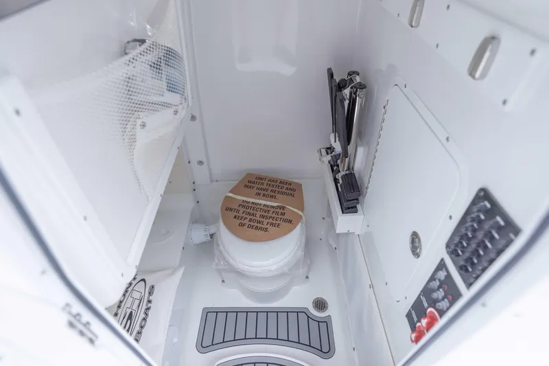  Yacht Photos Pics 2026 Sea Hunt Gamefish 27 Coffin Box interior with storage and control panel.