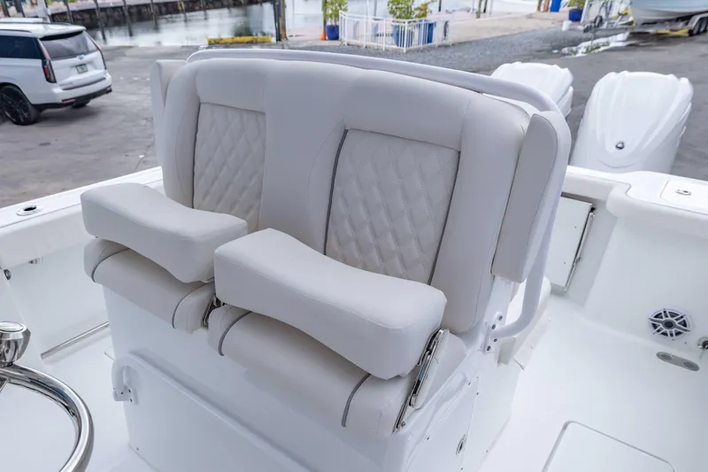 Yacht Photos Pics 2026 Sea Hunt Gamefish 27 Coffin Box boat seating with luxurious white upholstery.
