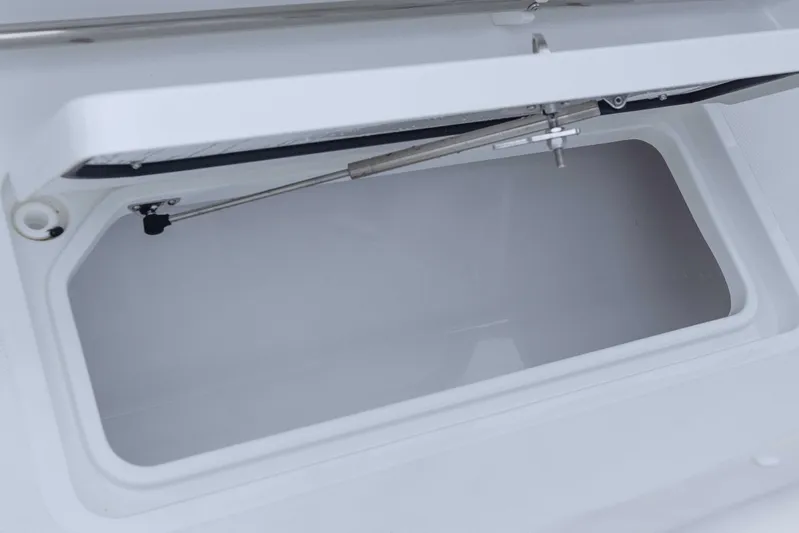  Yacht Photos Pics 2026 Sea Hunt Gamefish 27 Coffin Box, open storage compartment detail.