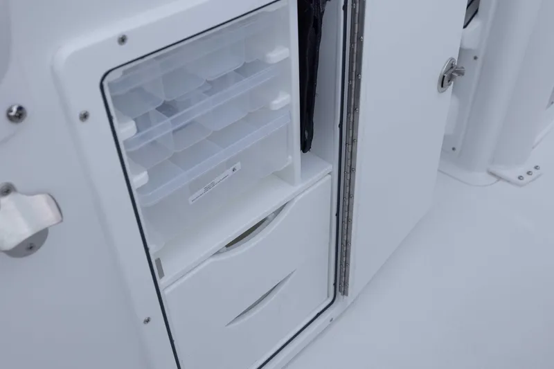  Yacht Photos Pics 2026 Sea Hunt Gamefish 27 Coffin Box storage compartment with organized trays and drawers.