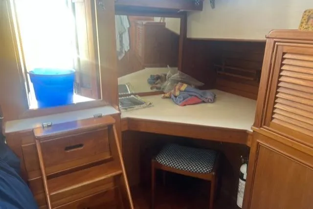 Slow Poke Yacht Photos Pics 1987 Grand Banks Classic Trawler interior with wooden cabinetry and storage space.