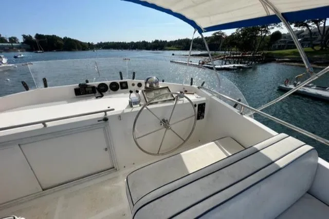 Slow Poke Yacht Photos Pics 1987 Grand Banks Classic Trawler helm with scenic water view.