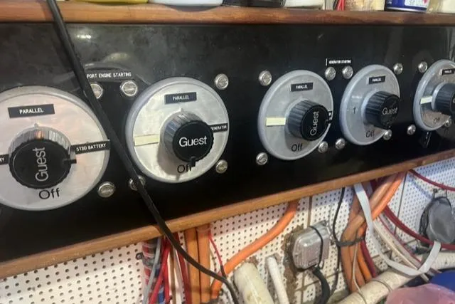 Slow Poke Yacht Photos Pics Control panel of a 1987 Grand Banks Classic Trawler, featuring multiple switches and wiring.