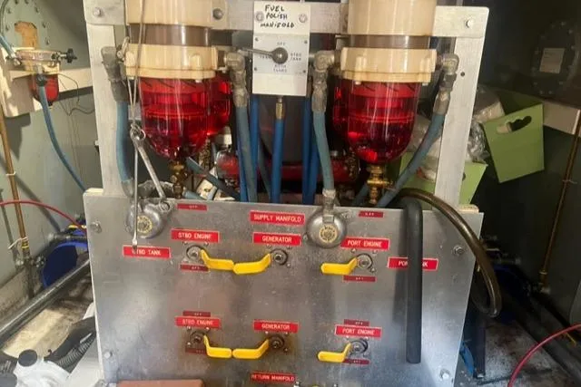 Slow Poke Yacht Photos Pics 1987 Grand Banks Classic Trawler fuel power manifold with labeled controls and red filters.
