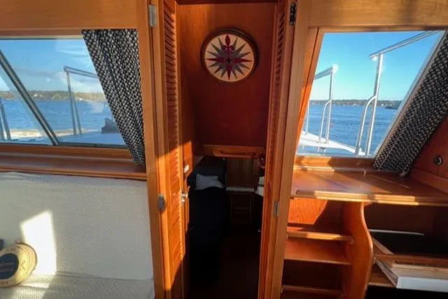 Slow Poke Yacht Photos Pics Interior view of 1987 Grand Banks Classic Trawler, showcasing woodwork and nautical decor.