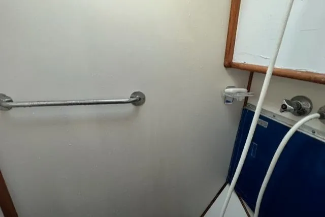Slow Poke Yacht Photos Pics 1987 Grand Banks Classic Trawler bathroom with showerhead and grab bar.