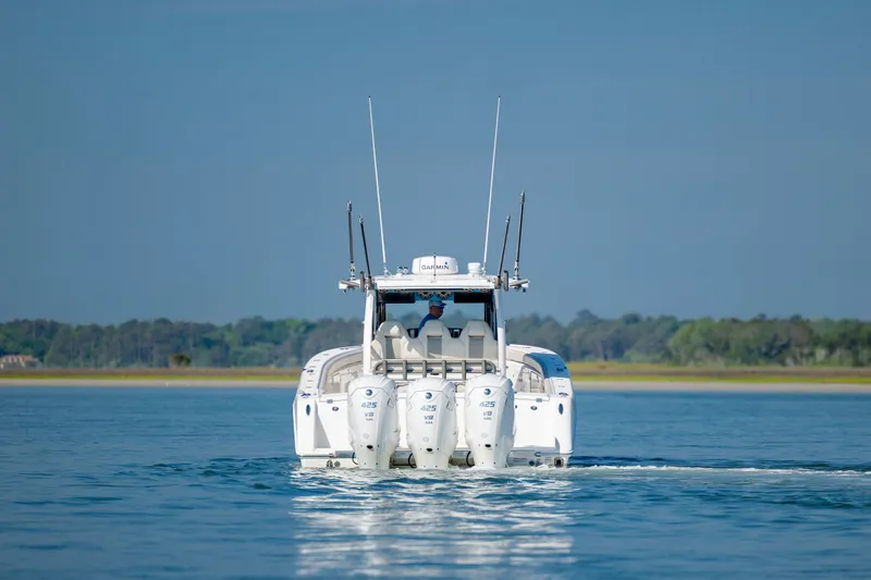  Yacht Photos Pics 2022 Solace 41 CS boat cruising on calm water with four engines.